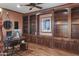 Spacious office features custom built-ins, hardwood floors and a ceiling fan at 15948 W Sheila Ln, Goodyear, AZ 85395