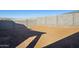 Backyard with concrete block fence. Ready to landscape at 17642 W Sanna St, Waddell, AZ 85355