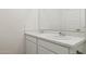Bright bathroom with double sinks, marble countertop and white cabinetry at 17642 W Sanna St, Waddell, AZ 85355
