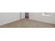 Neutral bedroom features plush carpet and bright natural light from the window at 17642 W Sanna St, Waddell, AZ 85355