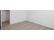 This bedroom features plush carpet and ample space with white walls at 17642 W Sanna St, Waddell, AZ 85355