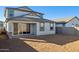 Exterior of the home shows a patio and backyard with room to customize at 17642 W Sanna St, Waddell, AZ 85355