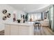 Open concept living area with a modern kitchen island and stylish decor at 17642 W Sanna St, Waddell, AZ 85355