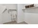 Spacious walk-in closet provides ample storage with shelving and hanging rods at 17642 W Sanna St, Waddell, AZ 85355