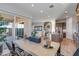 Open-concept dining area with sliding glass doors, seamlessly connecting indoor and outdoor spaces at 17807 W Mission Ln, Waddell, AZ 85355