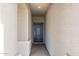 Entryway of home features light-colored walls with a dark-colored door at 17825 W Mission Ln, Waddell, AZ 85355