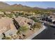 Aerial view of a home featuring a private driveway and a desert landscape at 18491 N 98Th Way, Scottsdale, AZ 85255
