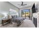 Tranquil main bedroom featuring a fireplace and backyard views at 18491 N 98Th Way, Scottsdale, AZ 85255