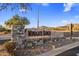 Attractive stone community sign for Windgate Ranch; welcoming entrance with mountain views at 18491 N 98Th Way, Scottsdale, AZ 85255
