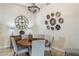 Elegant dining room featuring a round table, stylish decor, and a unique chandelier at 18491 N 98Th Way, Scottsdale, AZ 85255