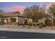 Beautiful home featuring desert landscaping, a two-car garage, and an arched entryway at 18491 N 98Th Way, Scottsdale, AZ 85255