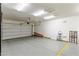 Clean and organized garage with epoxy flooring and ladder; practical and well-maintained space at 18491 N 98Th Way, Scottsdale, AZ 85255