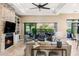 Spacious living area with views of the outdoor dining area and lush backyard at 18491 N 98Th Way, Scottsdale, AZ 85255
