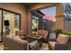 Inviting outdoor patio with comfortable seating around a fire pit, perfect for relaxing at 18491 N 98Th Way, Scottsdale, AZ 85255