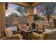 Relaxing outdoor patio with comfortable seating and tranquil sunset views at 18491 N 98Th Way, Scottsdale, AZ 85255
