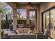 Spacious outdoor patio with cozy seating and scenic backyard views at 18491 N 98Th Way, Scottsdale, AZ 85255