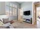 Cozy bedroom nook with bright window and stylish furnishings, perfect for relaxation at 18491 N 98Th Way, Scottsdale, AZ 85255
