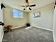 Bedroom featuring plush carpet, ceiling fan, natural lighting, and neutral tones at 1851 E Pleasant Ln, Phoenix, AZ 85042