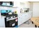 Contemporary kitchen with stainless steel appliances, white subway tile, and ample counter space at 1851 E Pleasant Ln, Phoenix, AZ 85042