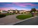 Gorgeous home with elegant architecture, lush landscaping, and inviting curb appeal in a desirable neighborhood at 19717 E Country Meadows Dr, Queen Creek, AZ 85142