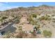 Aerial view of a home with a pool, covered patio, and landscaped backyard within a desert community at 2008 E Rock Wren Rd, Phoenix, AZ 85048