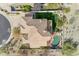 Aerial view showcasing the home's tile roof, pool, green lawn, and desert landscaping at 2008 E Rock Wren Rd, Phoenix, AZ 85048