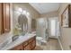 Well-lit bathroom featuring a vanity with sink, framed mirror, and a glass-enclosed shower at 2008 E Rock Wren Rd, Phoenix, AZ 85048