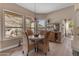Cozy dining room with natural light, views, and modern chandelier at 2008 E Rock Wren Rd, Phoenix, AZ 85048