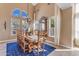 Spacious dining room with wooden table, seating for eight, and bright chandelier at 2008 E Rock Wren Rd, Phoenix, AZ 85048