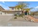 Charming two-story home with a three car garage, desert landscaping, and beautiful curb appeal at 2008 E Rock Wren Rd, Phoenix, AZ 85048
