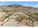 Stunning two-story home featuring desert landscaping, a three-car garage, and a charming brick walkway at 2008 E Rock Wren Rd, Phoenix, AZ 85048