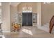 Elegant foyer with high ceilings, hardwood floors, and a staircase leading to the upper level at 2008 E Rock Wren Rd, Phoenix, AZ 85048