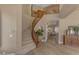 Grand foyer showcasing a curved staircase, wood railings, and inviting hallway views at 2008 E Rock Wren Rd, Phoenix, AZ 85048