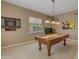 Game room showcasing a billiard table, dart board, and natural light at 2008 E Rock Wren Rd, Phoenix, AZ 85048
