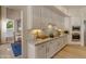Stylish kitchen with white cabinetry, marble countertops, and stainless steel appliances at 2008 E Rock Wren Rd, Phoenix, AZ 85048