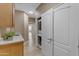 This well-equipped laundry area includes a stackable washer/dryer and ample storage space at 2008 E Rock Wren Rd, Phoenix, AZ 85048