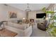 Comfortable living room with a fireplace, chandelier lighting, and modern furniture at 2008 E Rock Wren Rd, Phoenix, AZ 85048