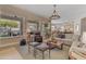 Spacious living area with large windows, fireplace, and open layout at 2008 E Rock Wren Rd, Phoenix, AZ 85048