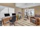 Inviting home office featuring a desk, exercise equipment, and comfortable seating at 2008 E Rock Wren Rd, Phoenix, AZ 85048