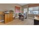 Bright home office with wooden desk, natural light, and stylish décor at 2008 E Rock Wren Rd, Phoenix, AZ 85048