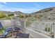 Covered patio offering panoramic mountain views with wicker seating at 2008 E Rock Wren Rd, Phoenix, AZ 85048
