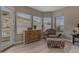 Cozy sitting room with desert views, a dresser, and a comfortable armchair at 2008 E Rock Wren Rd, Phoenix, AZ 85048