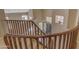 Elegant staircase with wood railings providing views of the entry and living room at 2008 E Rock Wren Rd, Phoenix, AZ 85048