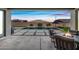 Covered patio overlooking pool and landscaped backyard, with a fire table and seating at 22372 E Duncan St, Queen Creek, AZ 85142