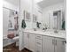 Modern bathroom with double sinks, a large mirror, and elegant fixtures at 22372 E Duncan St, Queen Creek, AZ 85142