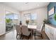Dining area with modern light fixture and sliding glass doors to the outdoor pool area at 22372 E Duncan St, Queen Creek, AZ 85142