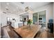 Open dining area with a view into the gourmet kitchen, with an outdoor view at 22372 E Duncan St, Queen Creek, AZ 85142