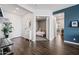 Welcoming home foyer with wood floors, a bedroom view, and modern decor at 22372 E Duncan St, Queen Creek, AZ 85142