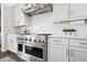 Chef-grade stainless steel range with double oven against a clean white subway tile backsplash at 22372 E Duncan St, Queen Creek, AZ 85142