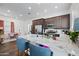 This kitchen has updated stainless steel appliances, granite countertops, and spacious bar seating at 22372 E Duncan St, Queen Creek, AZ 85142